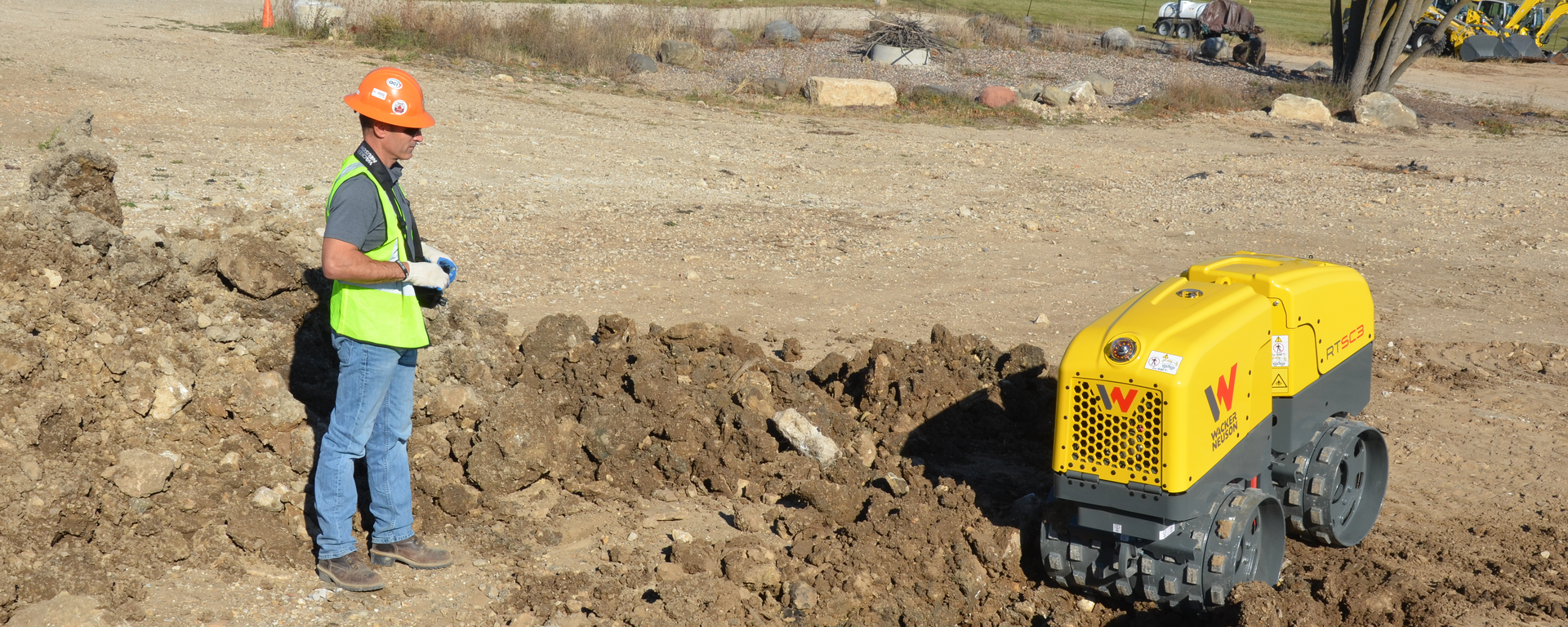 Wacker Neuson RTSC3 trench roller in action on a construction site.
